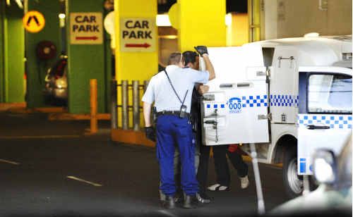 Uniformed police and detectives detain the two suspects in the Lismore Square undercover car park over the robbery that occurred at the Lismore KFC in nearby Ballina Road. Uniformed police and detectives detain the two suspects in the Lismore Square undercover car park over the robbery that occurred at the Lismore KFC in nearby Ballina Road.